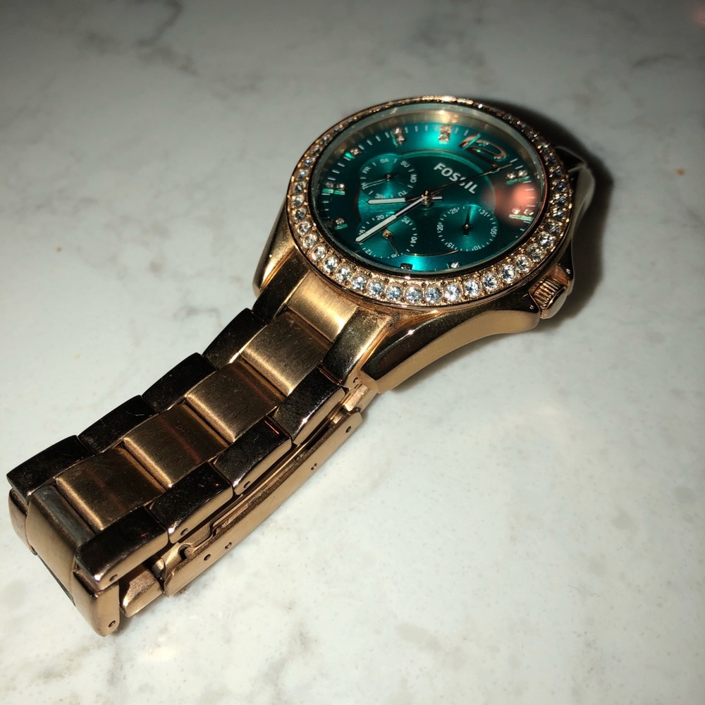 Fossil watch with gold band and turquoise face